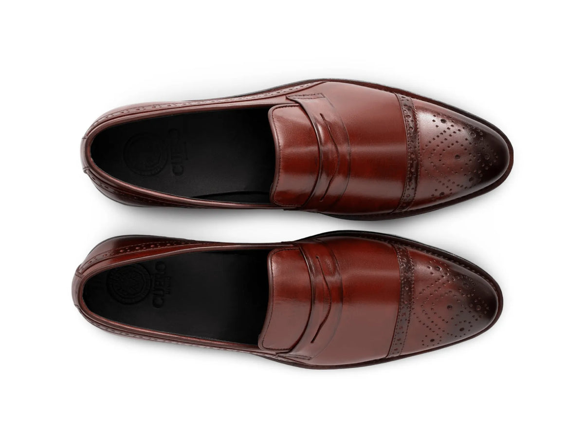 Top view of cognac brown brogue loafers showing perforated brogue detailing, stitching precision, and premium handcrafted leather texture