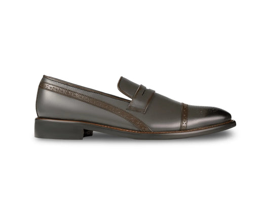 Side profile of Sovereign Noir loafers highlighting sleek silhouette, polished black leather, and refined luxury formal design