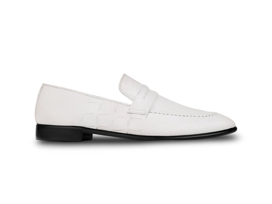 Side profile of Wilfred white leather loafers highlighting sleek silhouette, smooth leather finish, and refined luxury craftsmanship