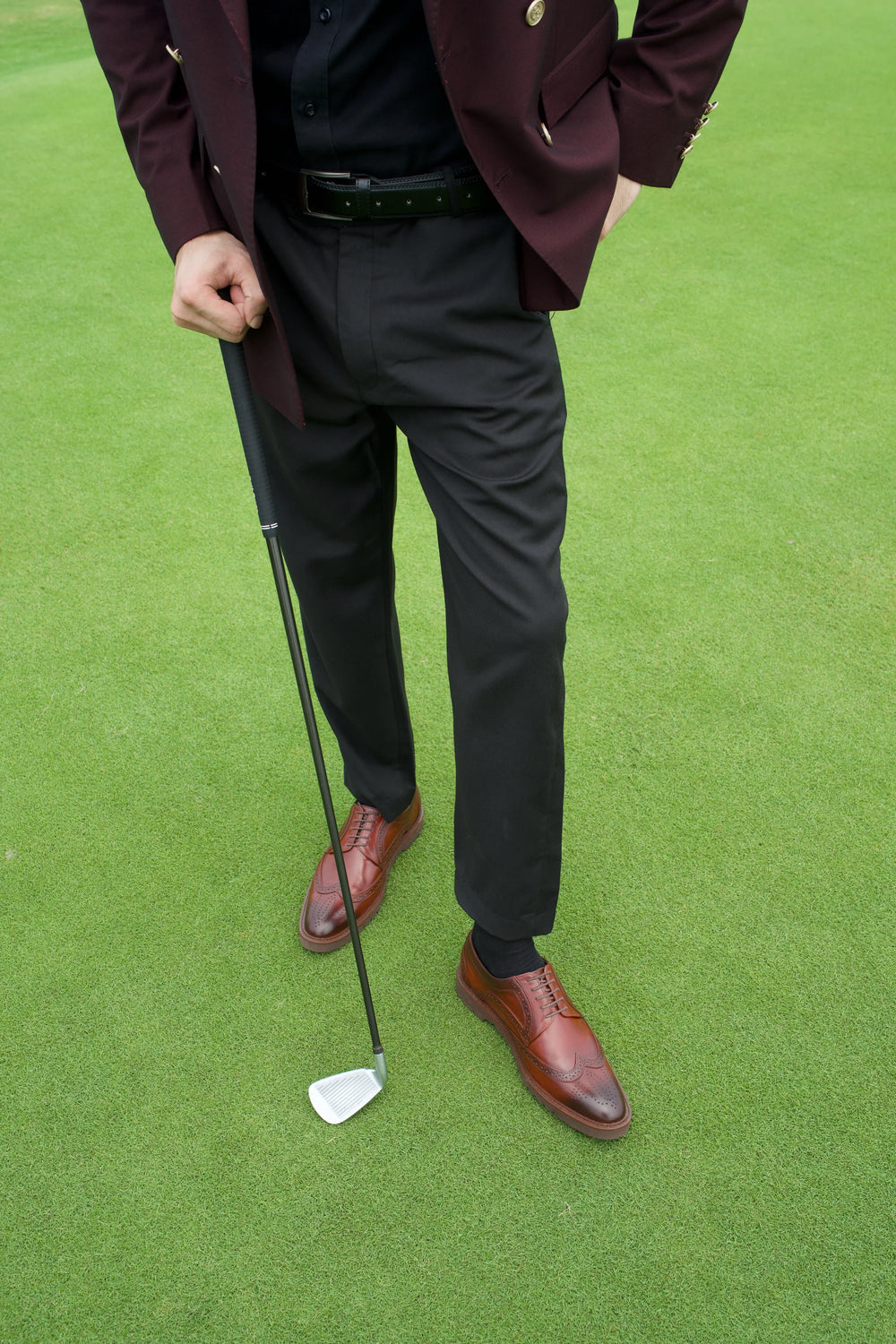Close view of brown Cueřo shoes on the green