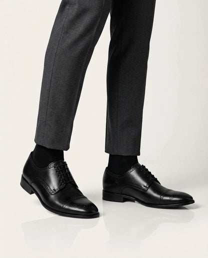 Regal Black worn with gray pants on a white background