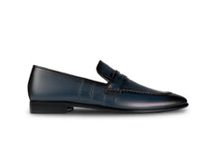 Side profile of Alton blue leather loafers highlighting sleek silhouette, premium finish, and luxury formal footwear design