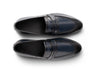 Top angled view of Alton blue leather loafers showing stitching detail, smooth leather finish, and refined craftsmanship