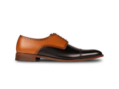 Side profile of Askari two-tone leather brogues highlighting refined silhouette, premium craftsmanship, and contrast leather design