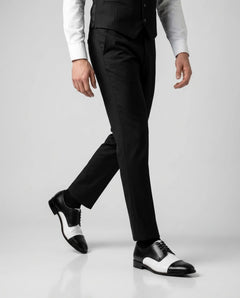 Bold Brogue dress shoes worn while walking in tailored outfit highlighting confident formal style and bold contrast design