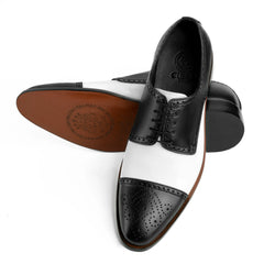 Bottom sole view of Bold Brogue shoes showing durable outsole grip and structured formal construction