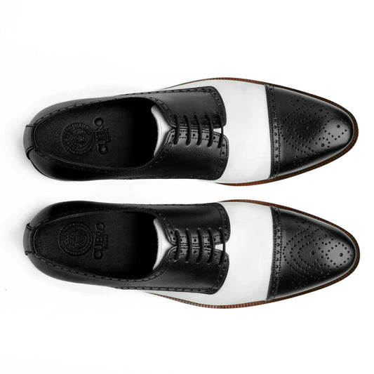 Top view of Bold Brogue shoes showing lace structure, brogue perforation, and black and white contrast leather design