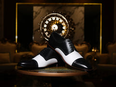 Bold Brogue shoes showing lace structure, brogue perforation, and black and white contrast leather design