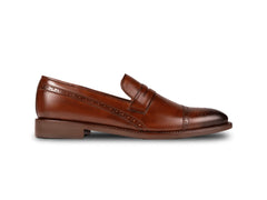Side profile of Carpio brogue leather loafer highlighting sleek silhouette, brogue detailing, and refined luxury craftsmanship