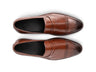 Top view of Carpio brogue leather loafer showing brogue perforation, stitching detail, and premium handcrafted leather finish