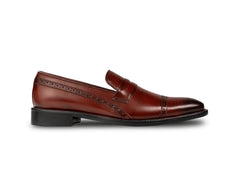 Side profile of cognac brown brogue loafers highlighting sleek silhouette, polished leather finish, and refined craftsmanship
