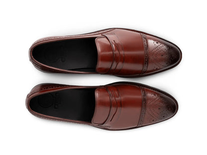 Top view of cognac brown brogue loafers showing perforated brogue detailing, stitching precision, and premium handcrafted leather texture