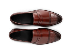 Top view of cognac brown brogue loafers showing perforated brogue detailing, stitching precision, and premium handcrafted leather texture