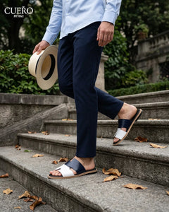 Man walking in Dastan Navy White minimalist patent leather slides for men