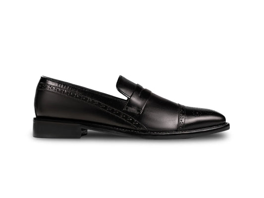 Side profile of Deyoshi black leather loafers highlighting sleek silhouette, refined stitching, and handcrafted luxury finish