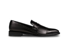 Side profile of Deyoshi black leather loafers highlighting sleek silhouette, refined stitching, and handcrafted luxury finish