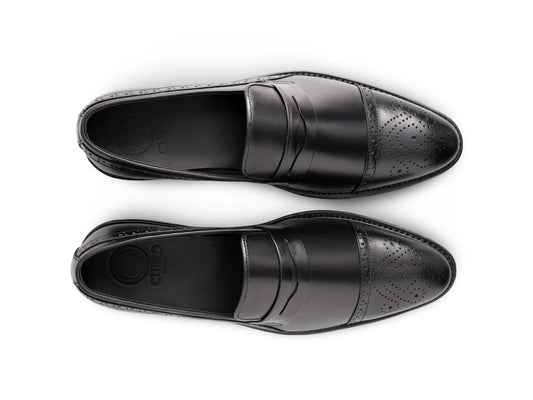 Top angled view of Deyoshi black leather loafers showing smooth leather texture, stitching detail, and premium craftsmanship