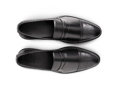 Top angled view of Deyoshi black leather loafers showing smooth leather texture, stitching detail, and premium craftsmanship