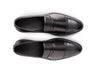 Top angled view of Deyoshi black leather loafers showing smooth leather texture, stitching detail, and premium craftsmanship
