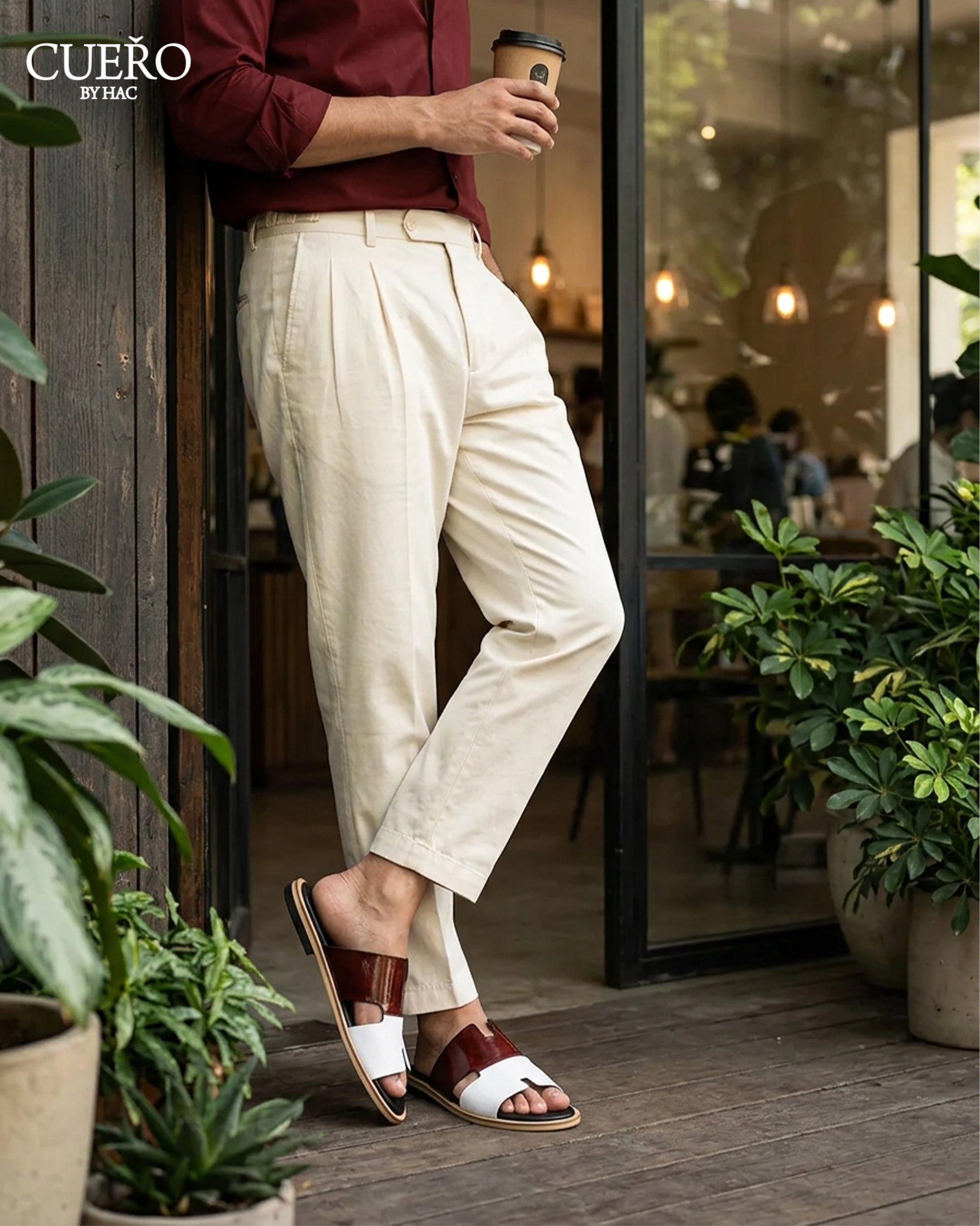 Modern patent leather slides photographed in luxury editorial environment