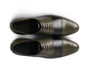 Top angled view of Ducaro wingtip lace-up shoes showing brogue perforation, lace structure, and premium leather craftsmanship