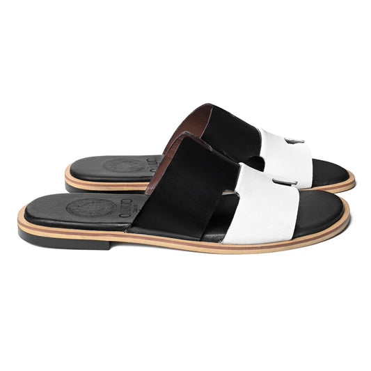 Front pair view of Dujan premium black and white leather slippers for men by Cuero by HAC