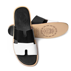 Dujan leather slippers showing Cuero by HAC embossed footbed and natural leather outsole