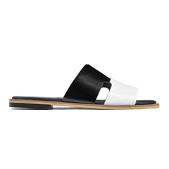 Side profile of Dujan black and white premium leather slide slippers for men