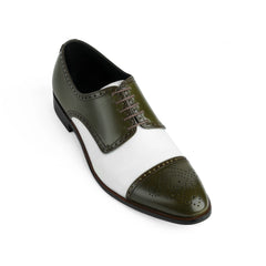 Close-up detail of Ebony and Ivory brogue shoes highlighting perforated leather craftsmanship and premium finishing