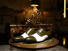 Editorial shot of Ebony and Ivory brogue shoes styled with suit in urban setting representing bold luxury formal footwear