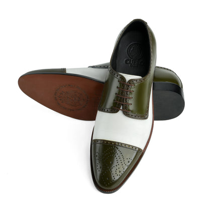 Bottom sole view of Ebony and Ivory brogue shoes showing durable outsole grip and structured construction
