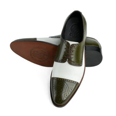 Bottom sole view of Ebony and Ivory brogue shoes showing durable outsole grip and structured construction