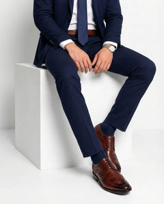 Edwin Brown lace-up shoes worn in seated pose highlighting comfort, craftsmanship, and premium brown leather formal design