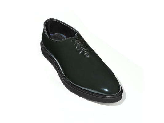 Elroy luxury green patent leather lace-up shoes with high shine finish and commando rubber sole displayed in clean minimal studio setup