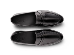 Top view of Hudson black leather loafers showing clean stitching, premium leather texture, and minimalist handcrafted design