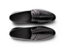 Top view of Hudson black leather loafers showing clean stitching, premium leather texture, and minimalist handcrafted design