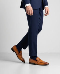 Hudson mustard leather loafers worn with tailored outfit in standing lifestyle shot showcasing bold color and modern luxury menswear style