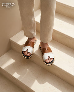 Minimal mustard designer slippers featuring premium leather craftsmanship