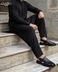 Man wearing Khyber 01 Jet Black Weave handcrafted leather Peshawari chappal with black shalwar kameez