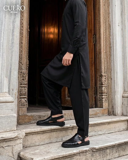 Man walking in Khyber 01 Jet Black Weave handcrafted Peshawari chappal
