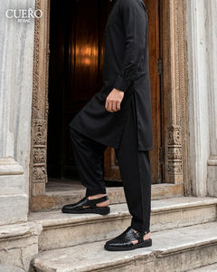 Man walking in Khyber 01 Jet Black Weave handcrafted Peshawari chappal
