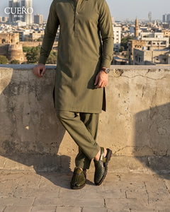 Man wearing Khyber 03 Olive Patina Weave handcrafted leather Peshawari chappal with traditional kurta shalwar