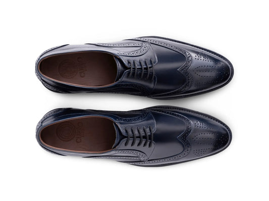 Top angled view of Leonardo Blue lace-up shoes showing lace structure, stitching detail, and elegant blue leather craftsmanship