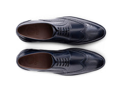 Top angled view of Leonardo Blue lace-up shoes showing lace structure, stitching detail, and elegant blue leather craftsmanship