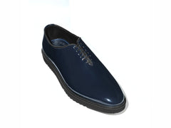 Lucifer Cueřo Grand Atelier navy blue patent leather formal dress shoes angled studio product shot highlighting glossy finish, sleek silhouette, and premium craftsmanship