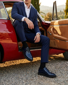 Lucifer Cueřo Grand Atelier navy blue patent leather formal dress shoes styled with tailored suit in a vintage car luxury lifestyle scene showcasing elegance and sophistication