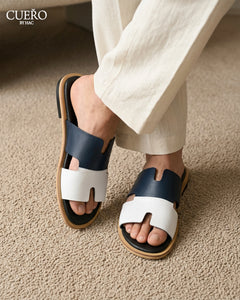 Close-up of Nilaan Blue luxury leather slides with refined detailing