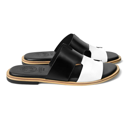 Side profile of Nishan black and white designer leather slippers for men by Cuero by HAC