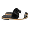 Side profile of Nishan black and white designer leather slippers for men by Cuero by HAC