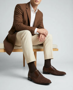 Nobelwood Lace-up suede and leather oxford shoes styled with formal outfit in lifestyle sitting pose showcasing luxury menswear aesthetic